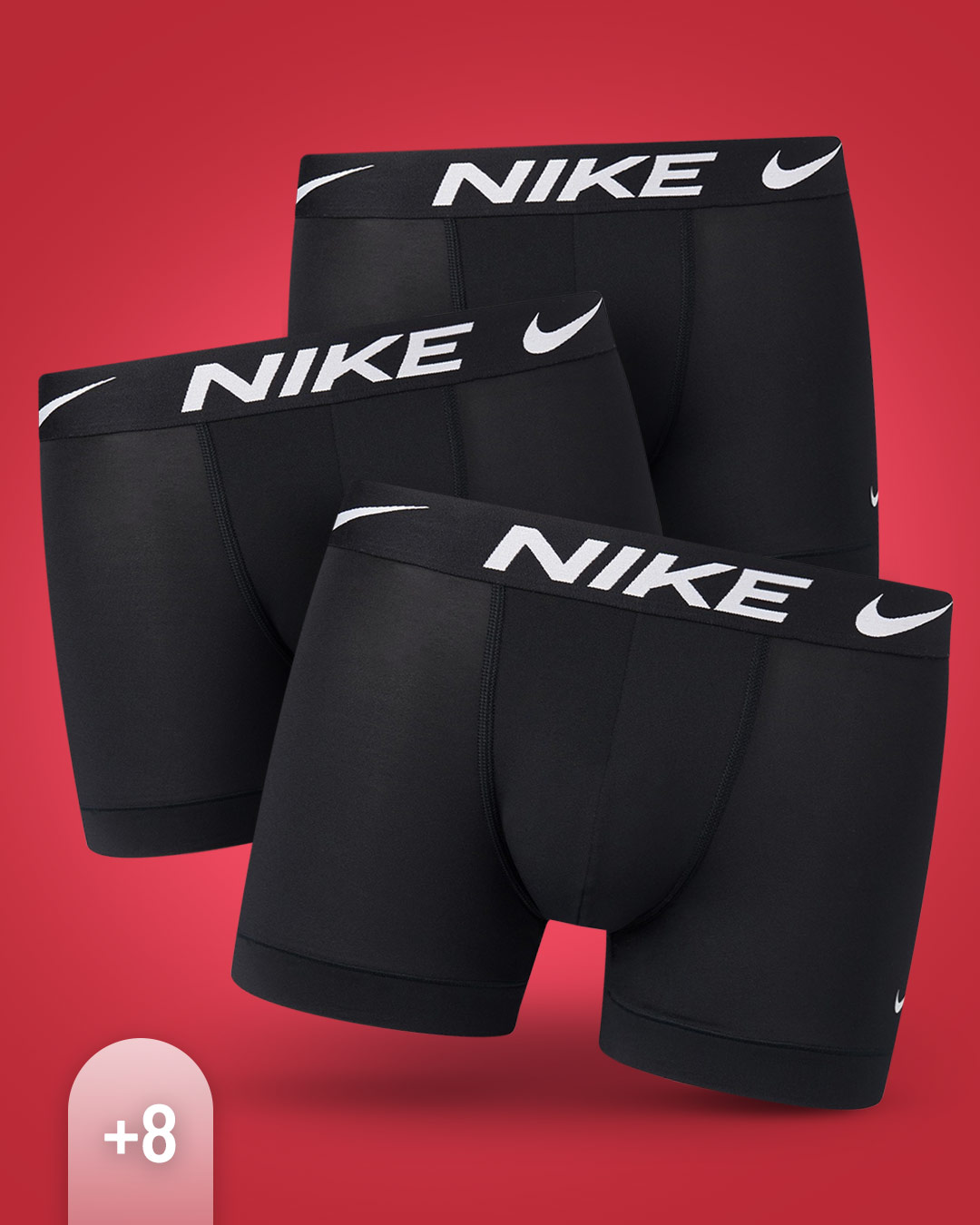 3 schwarze Boxershorts von Nike auf rotem Hintergrund.